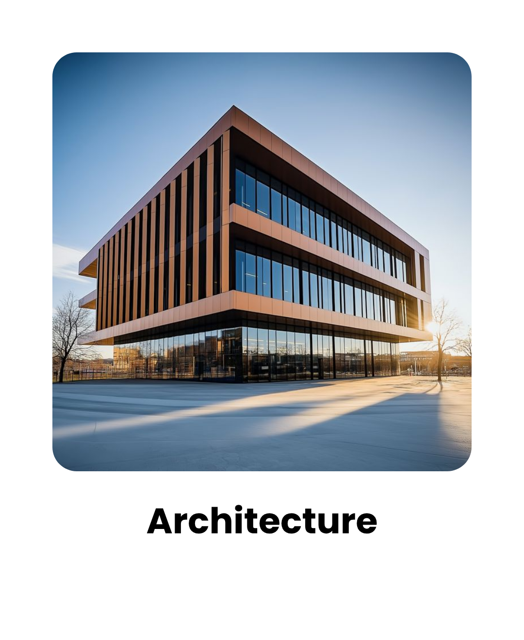 Modern glass office building with orange-brown vertical fins, seen from a low angle at sunset.