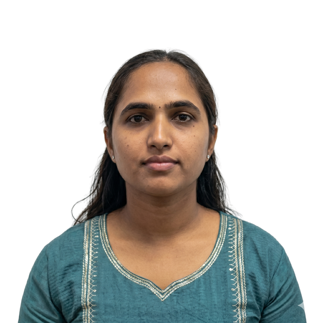 Portrait of a young woman with dark hair, facing the camera, wearing a teal traditional top against a plain white background.