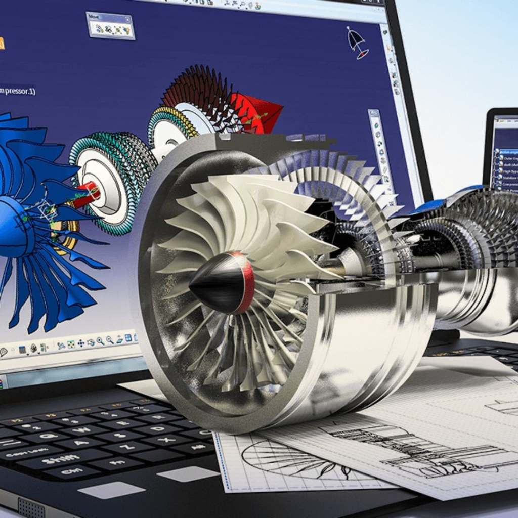 Engine turbine assembly rendered in front of a laptop and blueprints, illustrating CAD design work in progress