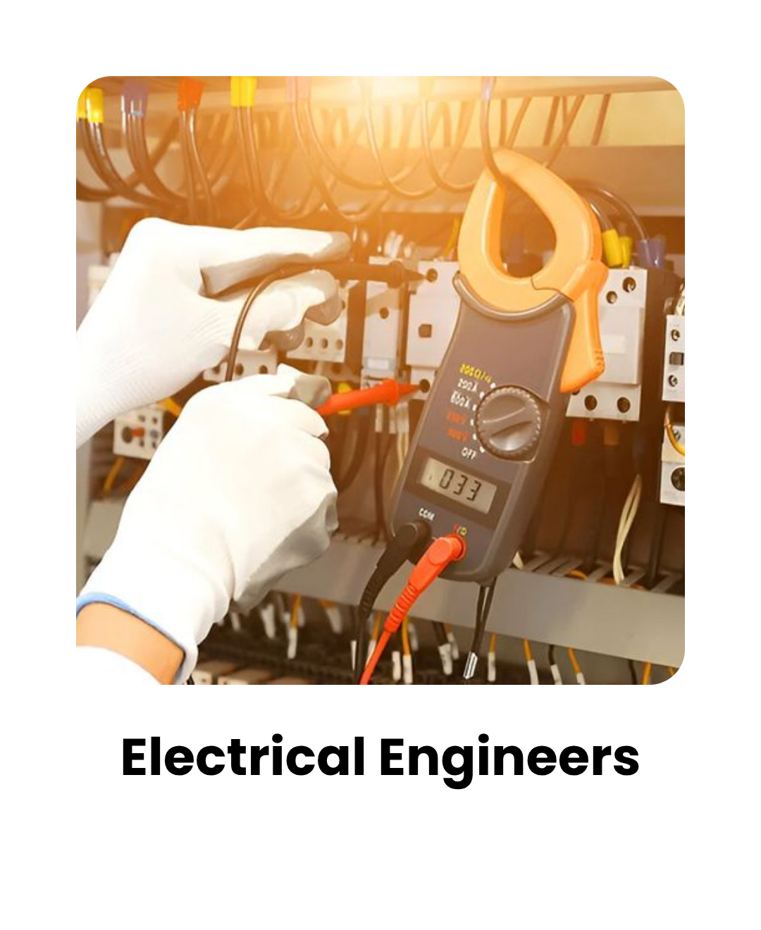 Electrician wearing gloves testing an electrical panel with a handheld multimeter and probes.