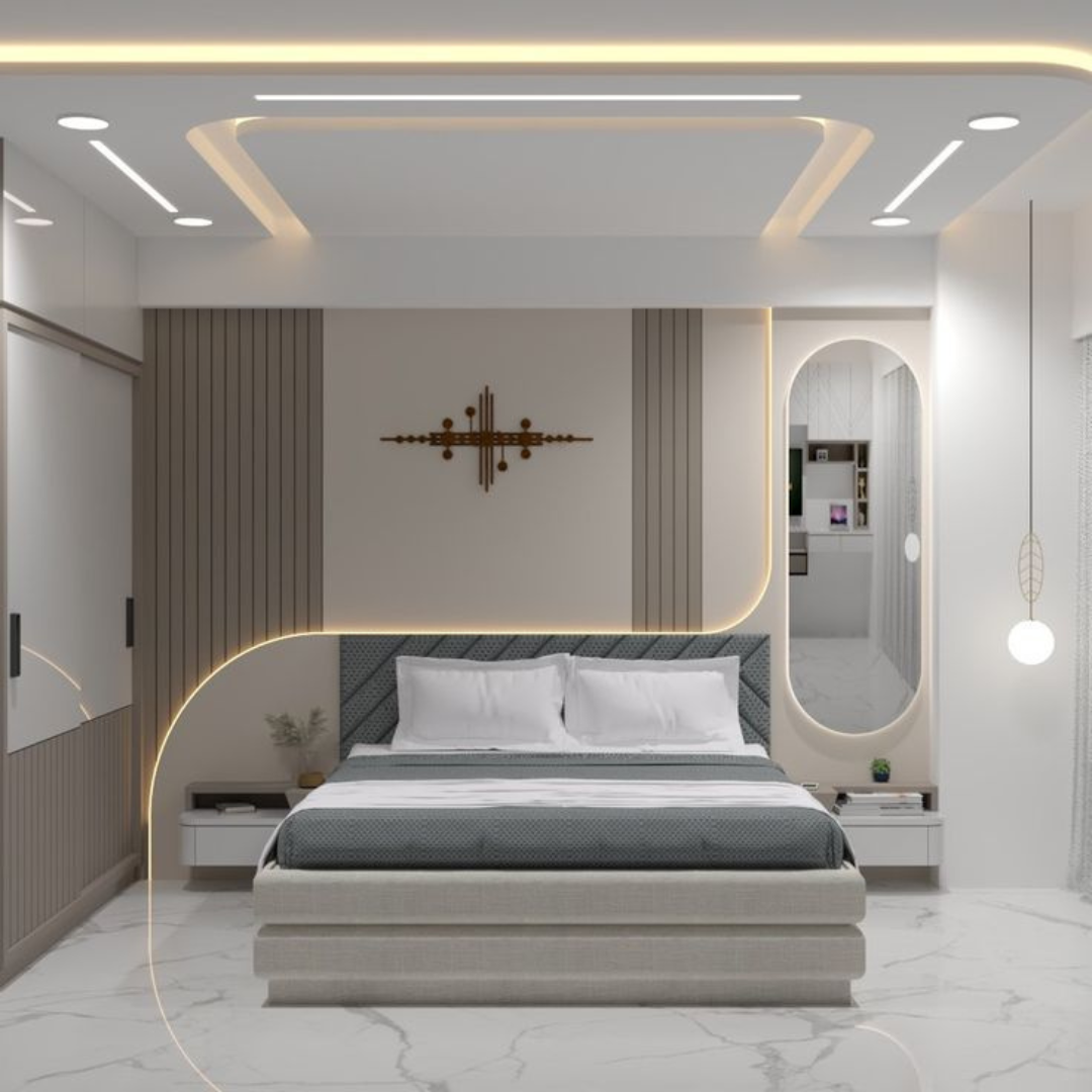 Modern bedroom with curved illuminated accents and a gray upholstered bed, white nightstands, and a circular mirror on the right.