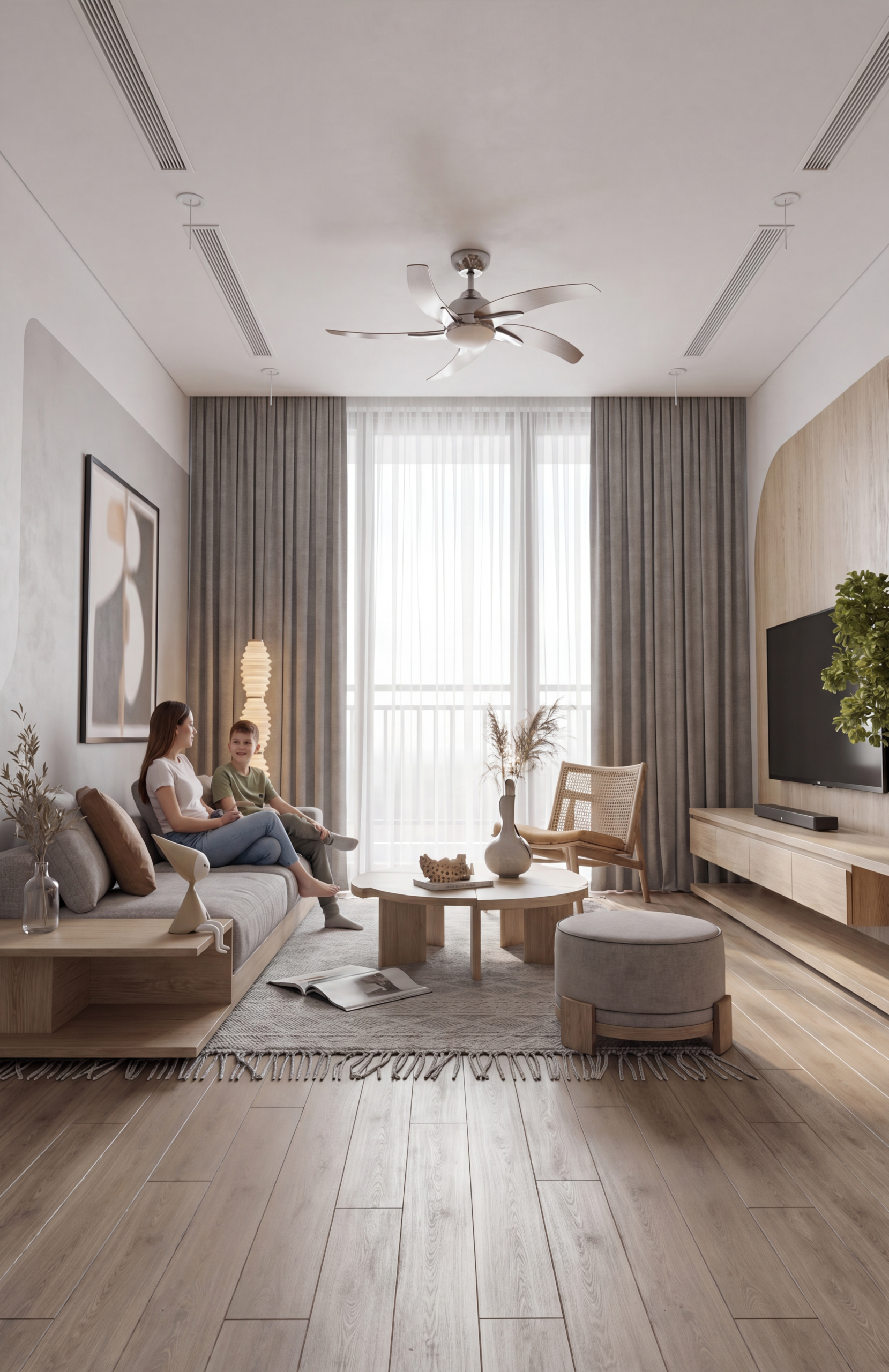 Contemporary living room with a ceiling fan, gray sofa, two people chatting, and a large window with sheer curtains.