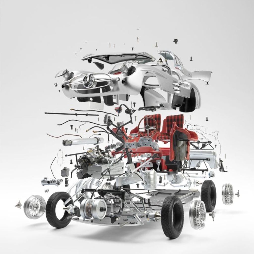 Exploded diagram of a car showing the engine, chassis, body panels, seats, and wheels separated to reveal internal components.