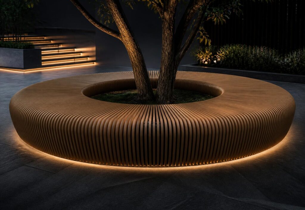 Circular wooden bench surrounds two trees, with warm ground lighting at night in a modern courtyard.